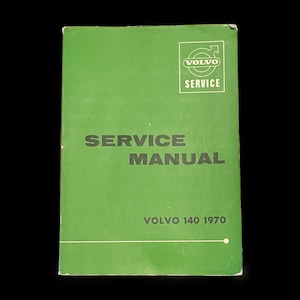 May include: Green service manual for a Volvo 140, 1970. The cover features the Volvo logo and the text "SERVICE MANUAL".