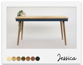 May include: A wooden desk with a dark blue top and tapered legs. The desk is made of natural wood with a light wood finish. The desk is 75 cm long and 45 cm wide.