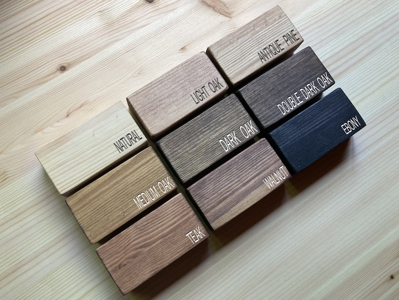 May include: Wood stain colour samples in various shades of brown, including natural, light oak, antique pine, medium oak, dark oak, double dark oak, teak, walnut, and ebony.