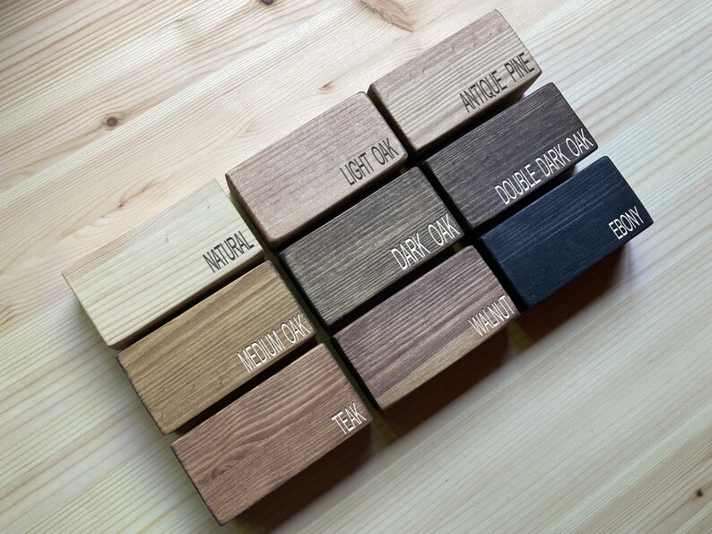 May include: Wood stain colour samples in various shades of brown, including natural, light oak, antique pine, medium oak, dark oak, double dark oak, teak, walnut, and ebony.