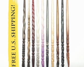 May include: Ten slender wooden wands arranged vertically, numbered 61 through 70. Each wand features a unique carved texture, including spiral, ribbed, and smooth designs in various shades of brown, black, white, and purple wood tones.