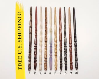May include: Ten slender wooden wands arranged vertically and numbered one through ten. The wands feature various carved textures, spiral patterns, and wood tones ranging from light cream to dark brown and black. A yellow vertical bar displays the text FREE U.S. SHIPPING!