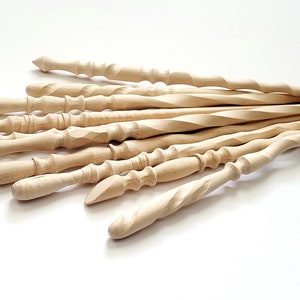 May include: A group of 10 unfinished wooden wands, each with a unique twist and shape. The wands are made of light-colored wood and are approximately 12 inches long.
