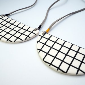 White grid bib necklace image 3