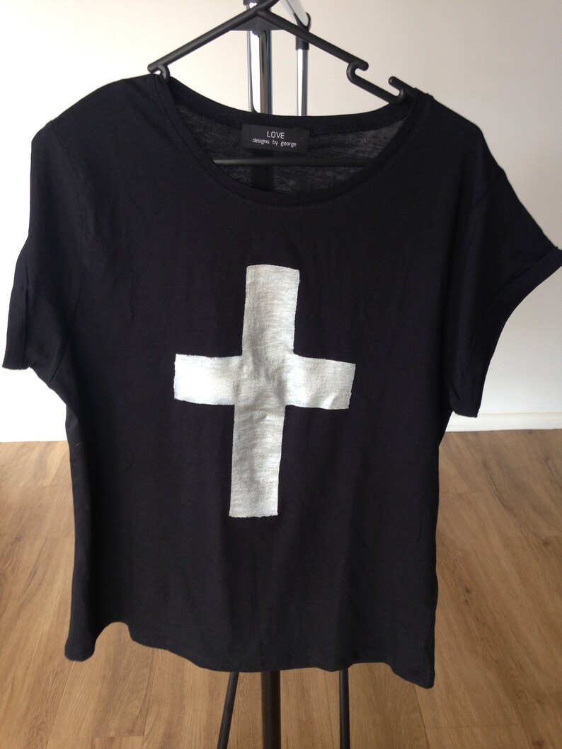 shirt with cross on it