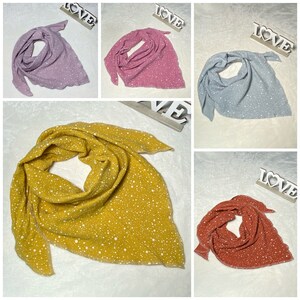 May include: Four triangular scarves with a white polka dot pattern on a solid color background. The scarves are in the colors lavender, pink, light blue, and orange.
