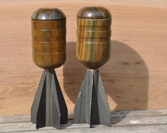 Desk pots in lignum vitae hard wood on metal missile fins.
