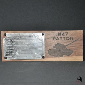 May include: A wooden plaque with an engraved M47 Patton tank design and text. A metal plate with technical details is attached. The plaque is made of dark wood, with a vintage style. The overall length is 204 inches.