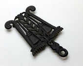 Griswold Cast Iron Broom Trivet