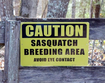 CAUTION SASQUATCH BREEDING area avoid eye contact" 12" aluminum sign