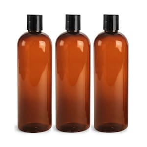 May include: Three amber glass bottles with black screw-on caps. The bottles are empty and ready to be filled.