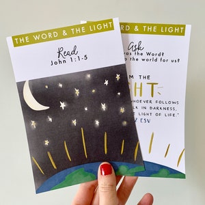 May include: Two cards with a night sky and stars illustration. The text on the cards reads "The Word & The Light" and includes bible verses from John 1:1-5 and John 1:2.