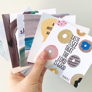 May include: A set of six cards with various illustrations and text. One card features a donut design with the text "Taste & See That The Lord Is Good" and "Psalm 34:8".