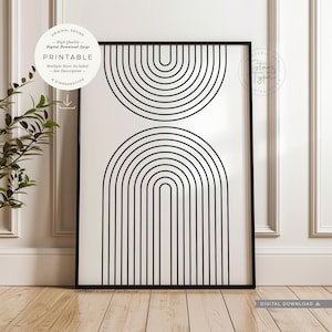 Op de afbeelding: Een rechthoekige kunstprint in een zwarte lijst met een witte achtergrond en twee gestapelde zwarte lijntekening-bogen. De bovenste boog is omgekeerd en de onderste boog staat rechtop. De tekst bevat ORIGINAL DESIGN, PRINTABLE en StarsAndType.