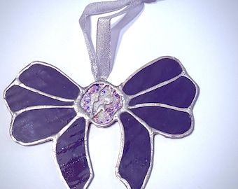 Atrapasol de cristal de colores con forma de calavera y lazo con purpurina
