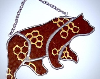Atrapasol de vidrio coloreado con forma de oso de miel