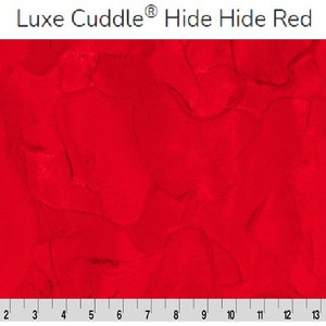 May include: Red fabric with a marbled pattern. The fabric is called "Luxe Cuddle Hide Hide Red".