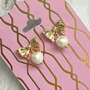 Dainty bow pearl drop earrings