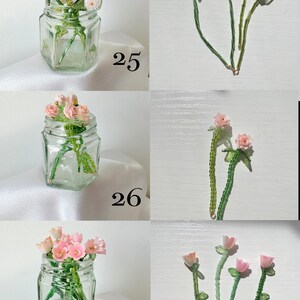 May include: Three sets of beaded flower stems labeled 25, 26, and 27. Each set features small glass or plastic flowers in shades of pink, lavender, and white with green beaded stems, displayed in clear glass jars and shown individually.