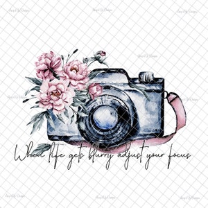 May include: A watercolor illustration of a vintage camera with a pink ribbon and a bouquet of pink peonies. The text "When life gets blurry adjust your focus" is written below the camera.