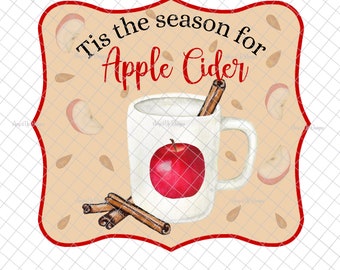 May include: A tan-colored sign with a red border and rounded corners. The sign says "Tis the season for Apple Cider" in black text. A white mug with a red apple and cinnamon sticks is pictured on the sign.