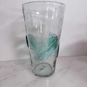 May include: A set of three ceramic mugs with a speckled, matte finish. The mugs are in shades of cream, light gray, and dark gray. Each mug has a simple, minimalist design, perfect for coffee or tea.