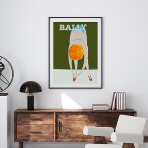 May include: A vintage poster with the word "BALLY" in bold, white letters on a dark green background. A woman with orange hair is bending over, wearing a blue swimsuit and pink shoes.
