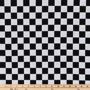 May include: Black and white checkered fabric with a ruler for scale. The fabric is a classic checkered pattern with alternating black and white squares.