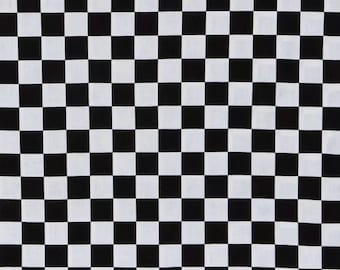 May include: Black and white checkered fabric with a ruler for scale. The fabric is a classic checkered pattern with alternating black and white squares.
