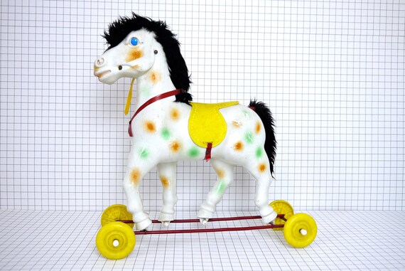 vintage toy horse on wheels