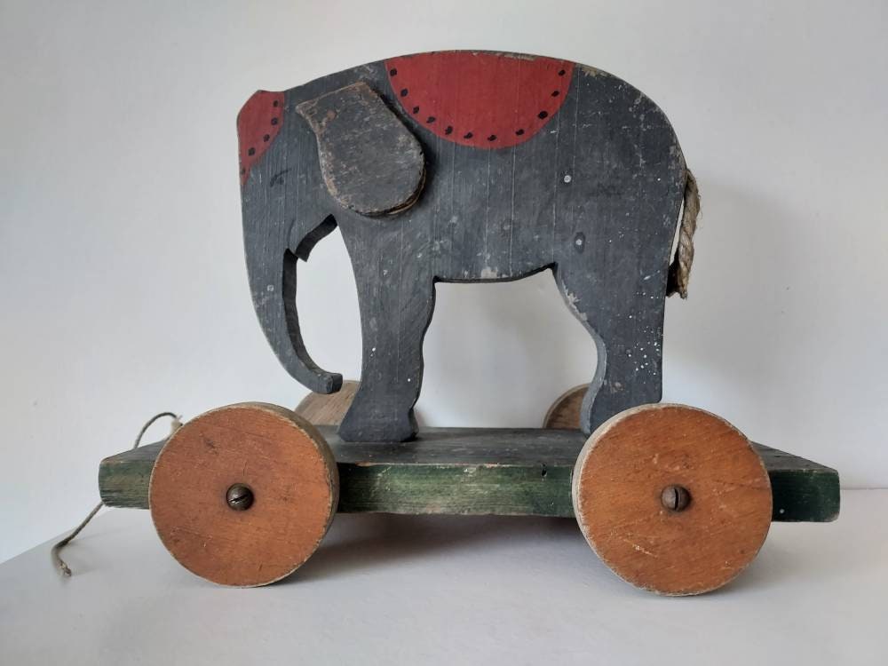 1910 stuffed elephant on wheels