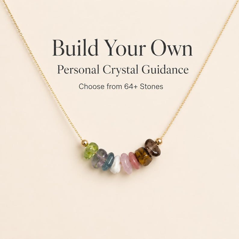 May include: A gold-colored necklace with a pendant of colorful gemstones. The necklace features a variety of stones in shades of green, blue, pink, and brown. Text on the image reads "Build Your Own Personal Crystal Guidance. Choose from 64+ Stones."