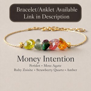 May include: A gold chain bracelet featuring five raw, multi-colored gemstones: peridot, moss agate, ruby zoisite, strawberry quartz, and amber. The text reads: Bracelet/Anklet Available Link in Description, Money Intention, Peridot, Moss Agate, Ruby Zoisite, Strawberry Quartz, Amber.