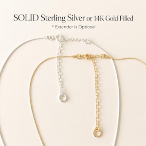 May include: Close-up of two necklaces, one silver and one gold, with extender chains. The silver necklace is solid sterling silver, and the gold necklace is 14K gold filled. Text at the top reads "SOLID Sterling Silver or 14K Gold Filled".