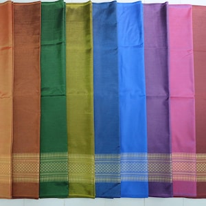 May include: Ten different colored fabric swatches with a woven pattern. The swatches are arranged in a row from left to right, with the colors ranging from orange to red.