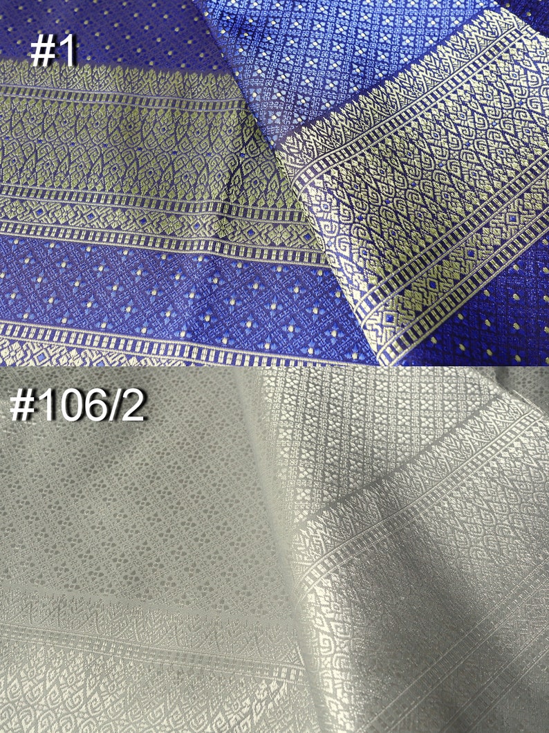 May include: Two pieces of fabric with intricate patterns. The top piece is a dark blue fabric with a gold and white pattern. The bottom piece is a light gray fabric with a gold pattern. The fabric is labeled #1 and #106/2.