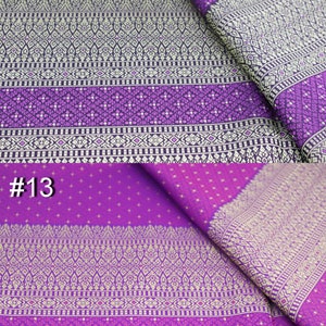 May include: Purple and gold fabric with a repeating geometric pattern. The fabric is folded in half and the numbers #4 and #13 are visible in the image.