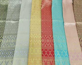 May include: A selection of eight different patterned fabrics in various colors, including black, gray, gold, red, blue, and pink. The fabrics have a subtle sheen and feature intricate designs.