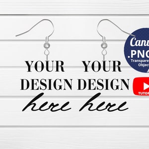 May include: A mockup image of two silver earring hooks with the text "YOUR DESIGN here" on a white wood background. The image includes a Canva logo and a YouTube tutorial icon.