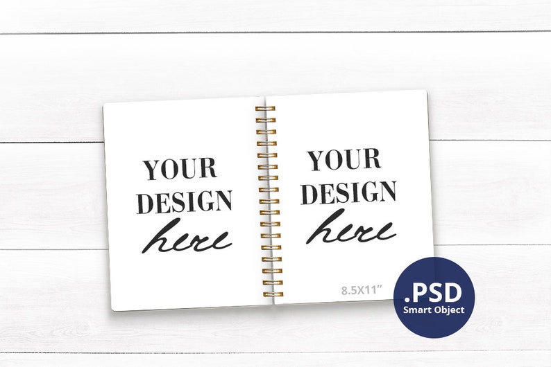May include: A white notebook with a gold spiral binding. The notebook is open and has the text "YOUR DESIGN here" on both pages. The notebook is 8.5x11 inches and is a PSD Smart Object.