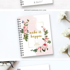 May include: A white spiral bound notebook with a floral design and the text "make it happen" in gold lettering. The notebook is labeled as a goal planner and measures 8.5 by 11 inches.
