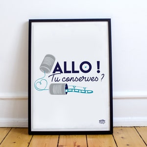 May include: A framed print with a white background and a blue and gray illustration of two tin cans connected by a string. The text "ALLO! Tu conserves?" is written in blue below the illustration.