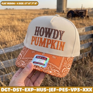 May include: A beige baseball cap with a structured crown featuring the embroidered text HOWDY PUMPKIN in brown and orange. The brim displays an orange and white paisley bandana pattern and includes a sticker labelled OTTO CLASSIC PIT OSFM.