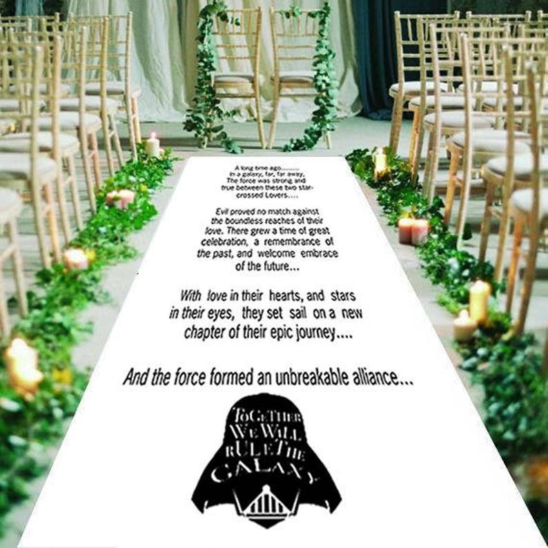 May include: A white aisle runner with black text and a black and white graphic of a Star Wars character. The text reads: "A long time ago... in a galaxy, far, far away... The force was strong and true between these two star-crossed Lovers... Evil proved no match against the boundless reaches of their love. There grew a time of great celebration, a remembrance of the past, and welcome embrace of the future... With love in their hearts, and stars in their eyes, they set sail on a new chapter of their epic journey... And the force formed an unbreakable alliance... Together We Will Rule The Galaxy"