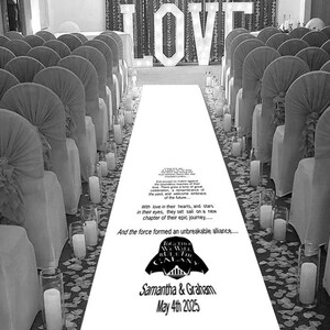 May include: A black and white wedding aisle runner with a Star Wars theme. The aisle runner features the text "Together We Will Rule The Galaxy" with a Darth Vader silhouette. The text "Samantha & Graham May 4th 2025" is printed at the bottom of the aisle runner.