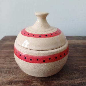 Ceramic decorated lidded jar; Ceramic box with a matching hand painted lid