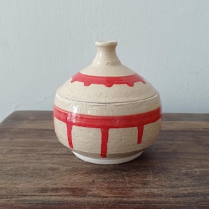 Ceramic decorated lidded jar; Ceramic box with a matching hand painted lid