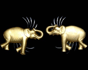 Vintage Pair of Gold Tone Elephant with Silver Palms behind them.