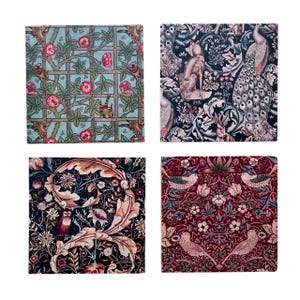 May include: Four square coasters with different floral patterns. The coasters feature a variety of colors, including red, blue, green, and black. The patterns are intricate and detailed, and the coasters are made of a high-quality material.