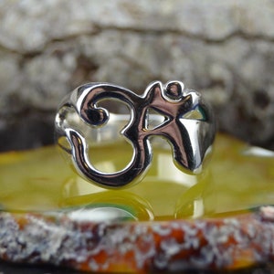 Wide band sterling silver ring with OM design in sizes 6, 7, 8, 9, 10